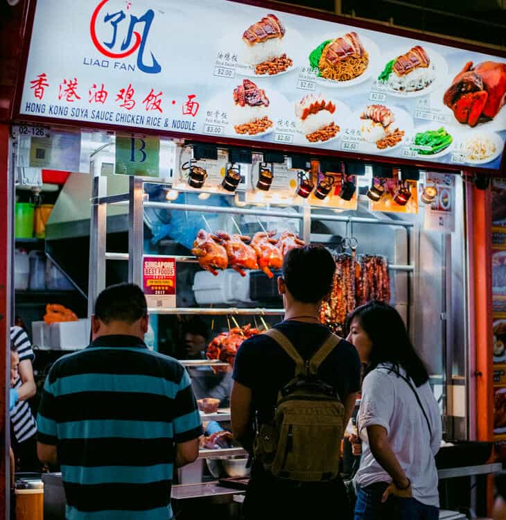 People waiting to be served at fast food stand in Singapore