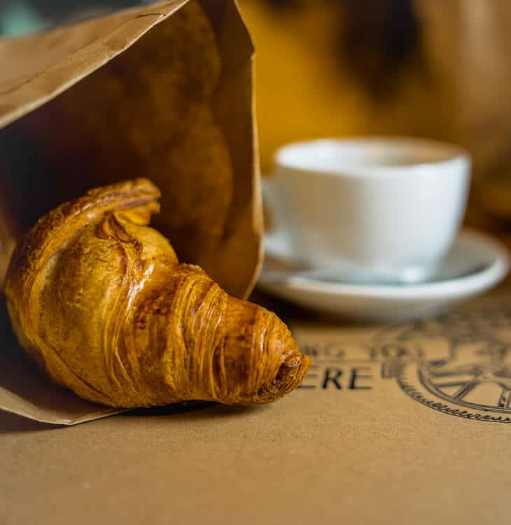 Breakfast croissant with coffee in Graz