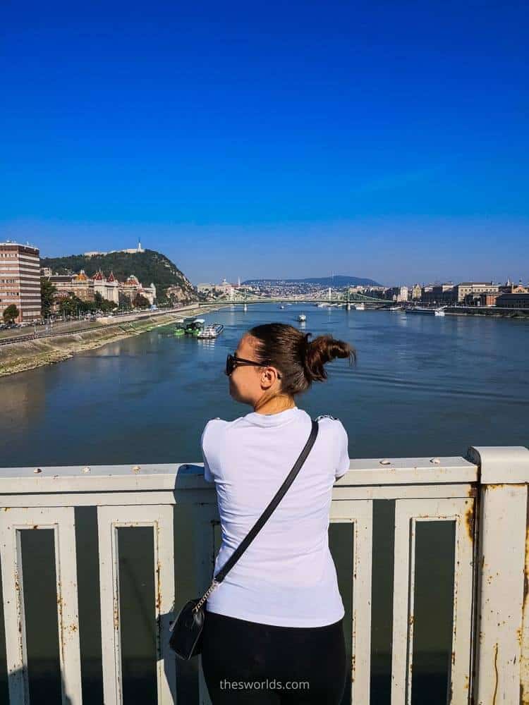 Girl looking at Danube river from bridge