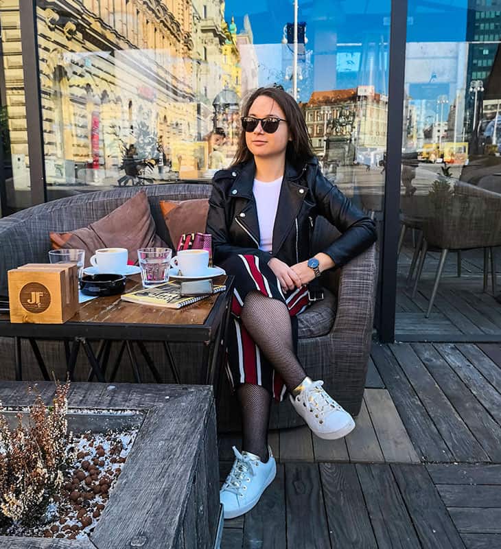 Girl posing while drinking coffee in Zagreb