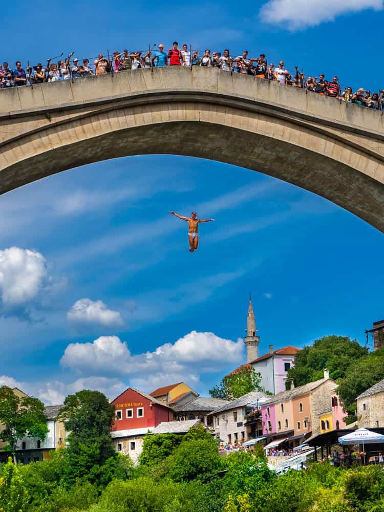 People watching a man jumping from Old bridge in Mostar