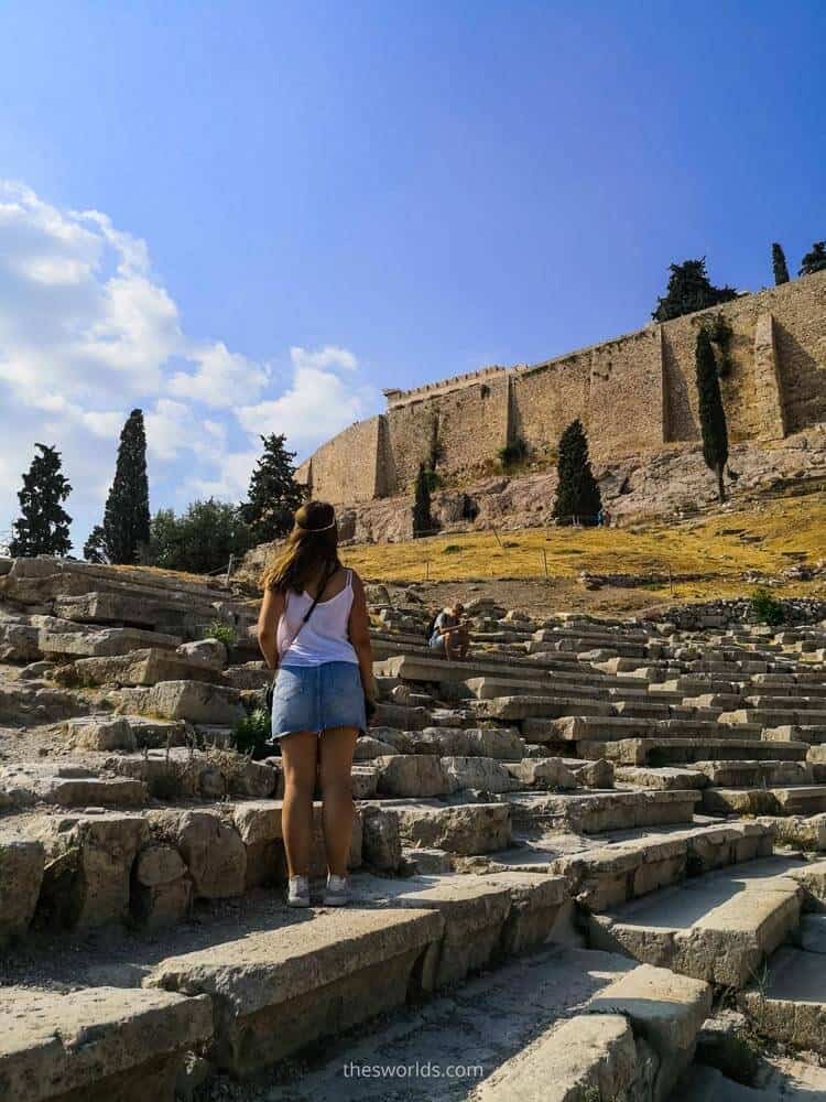Girl standing at ancient stairs in Athens