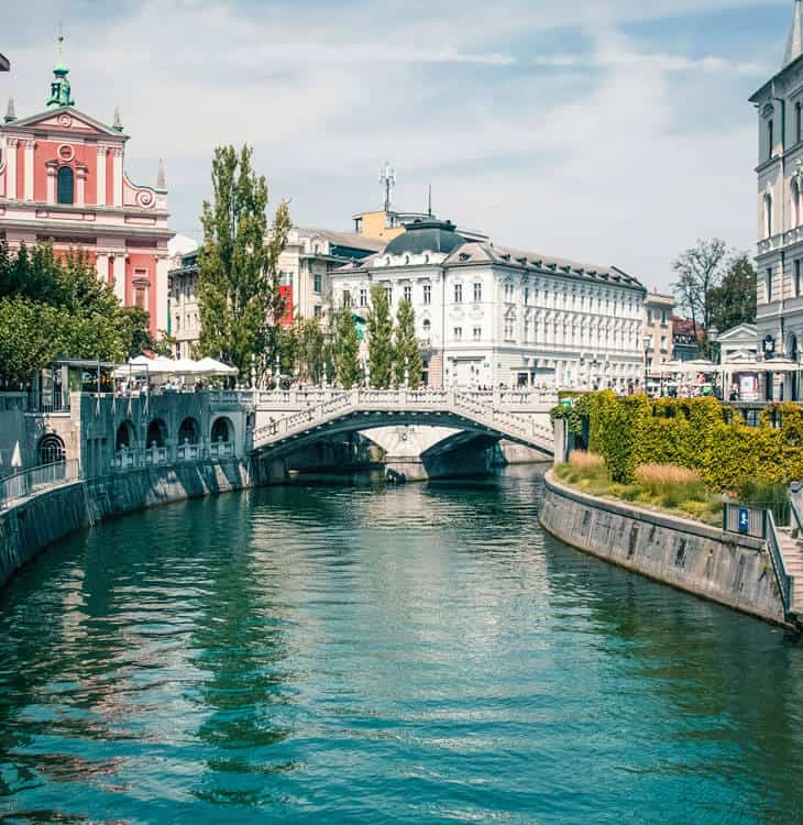 View of people walking over bridges in Ljubljana