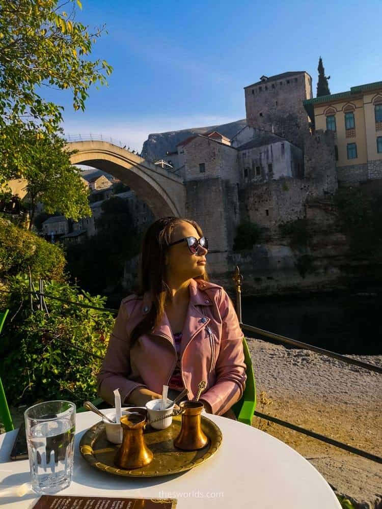 Girl drinking coffee in Mostar