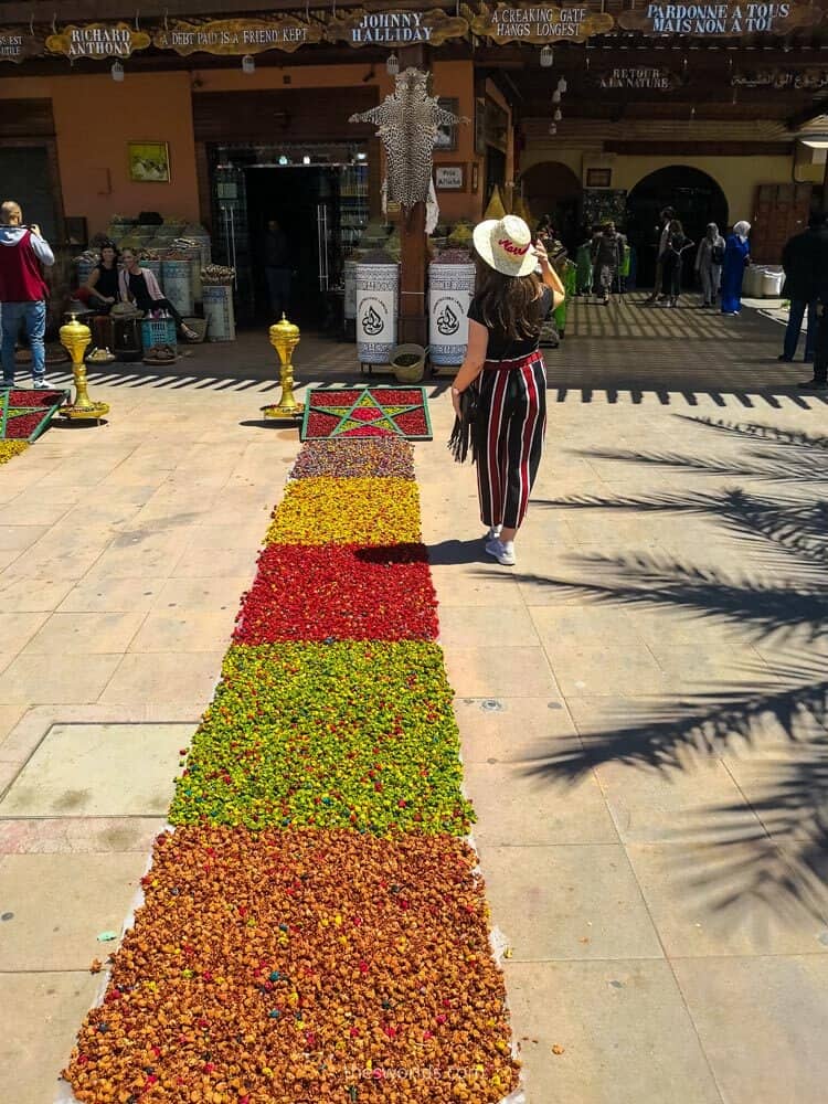 Girl posing next to morocco spices