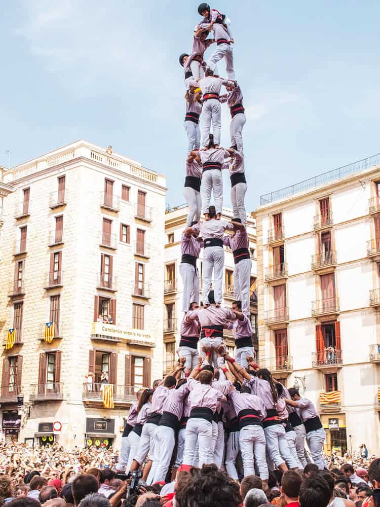 People standing atop one another in Barcelona