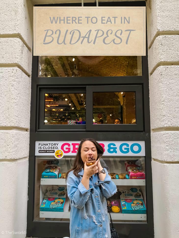 Girl eating donuts at Budapest
