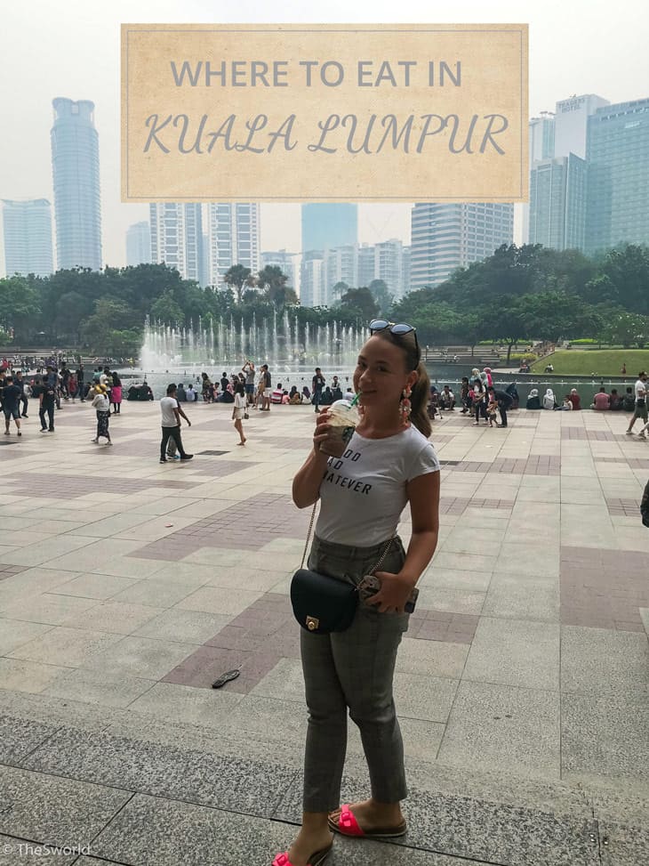 Girl drinking ice coffee at Kuala Lumpur park