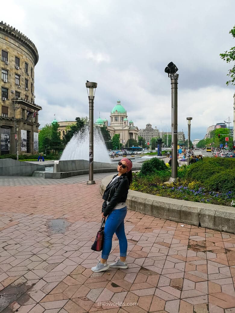 Girl posing in front of Belgrade parlament