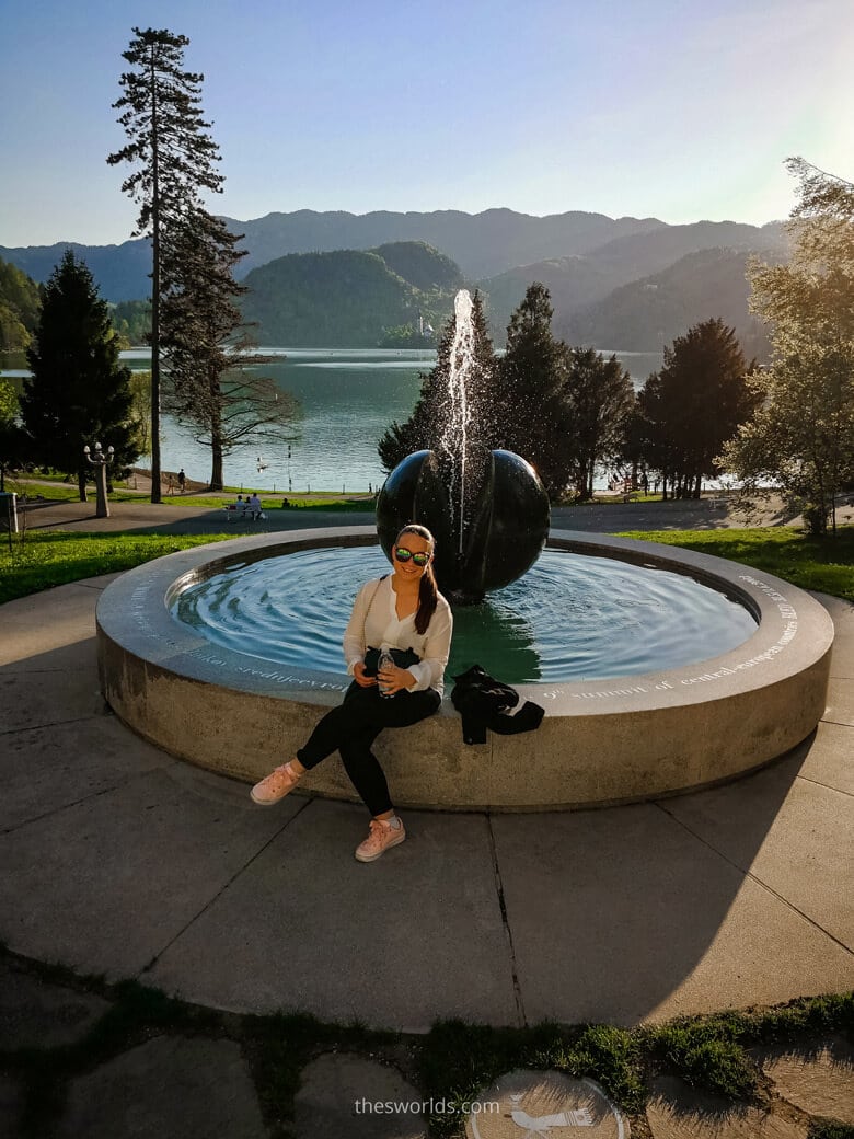Girl posing in front of fountain at Bled Lake