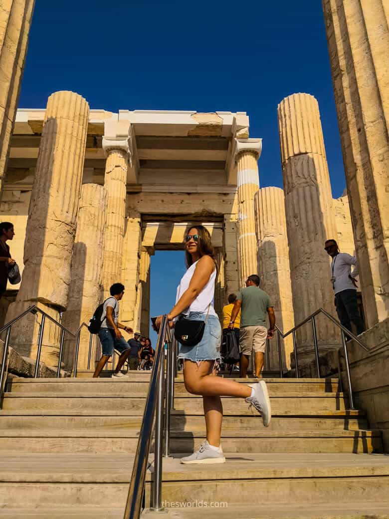 Girl posing in front of entrance to Parthenon