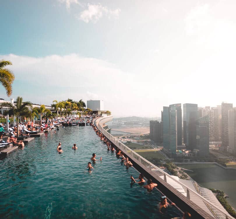 People swimming at Marina bay rooftop pool in Singapore