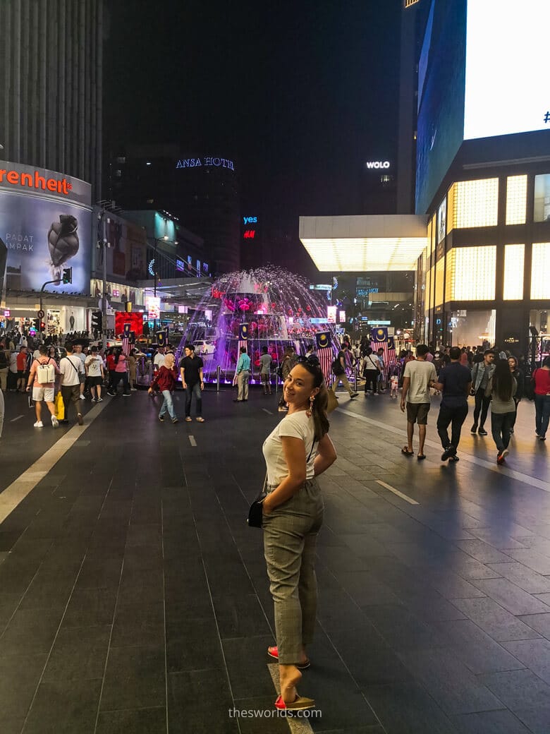 Girl standing at entrance to Pavillion Kuala Lumpur shopping mall