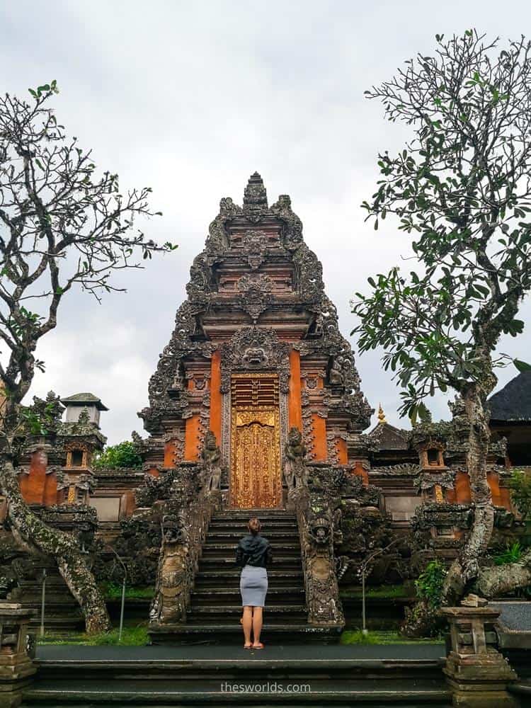 Girl standing and looking at Saraswati temple in Ubud