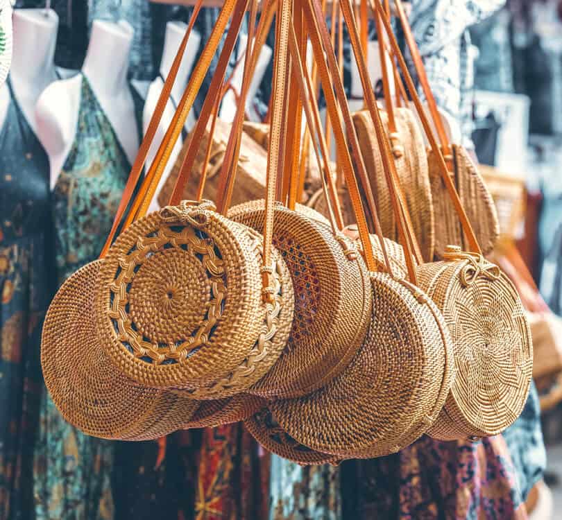 Balinese straw bags with dresses in the background