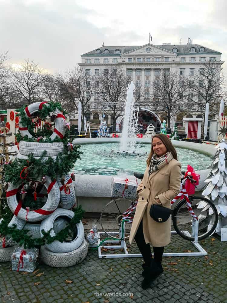 Girl standing in front of Christmas decorated fountain in Zagreb