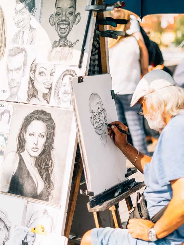 Man drawing people in Prague