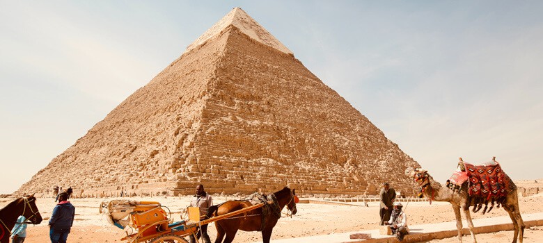 People in front of pyramids in Egypt