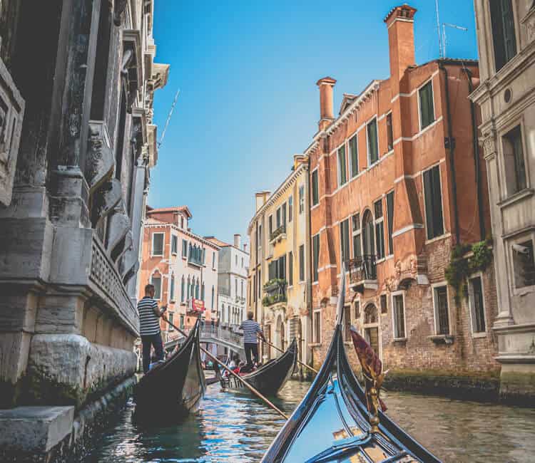 People riding Gondola in Venice
