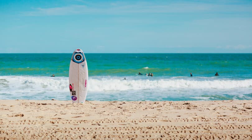 Surfing board on a sand beach