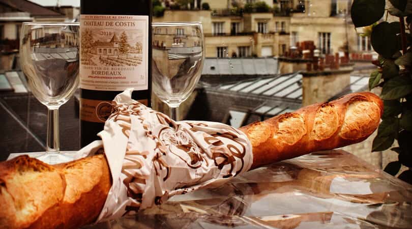 Baguette with wine and glasses in France