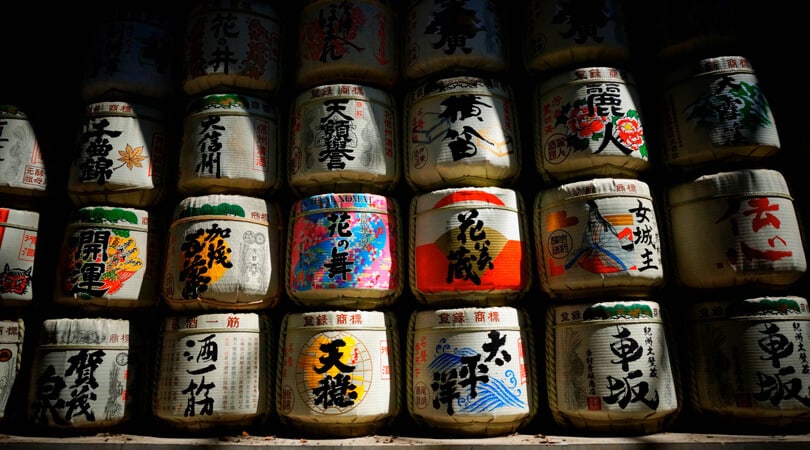 Bottles of sake sitting on each other
