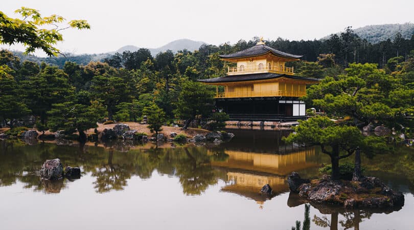 Golden temple near water in Japan